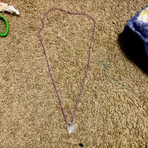 Comes with a triangle charm and we made it ourselves